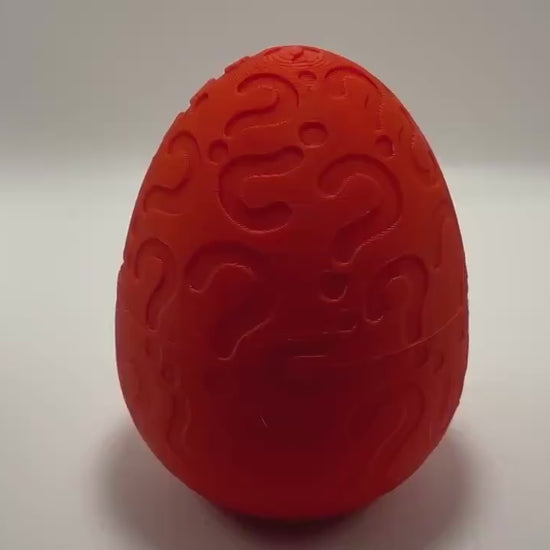 Christmas mystery egg with holiday-themed mini toys and festive packaging